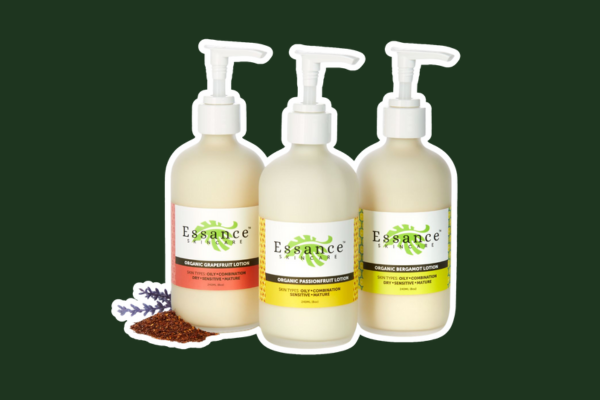 Three organic lotion bottles scented with grapefruit, passionfruit and bergamot.