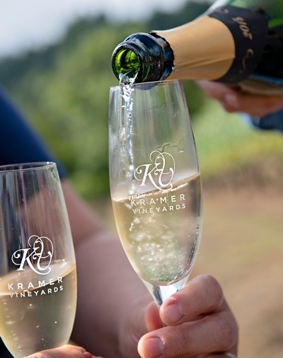 Pouring sparkling wine into a champagne flute.