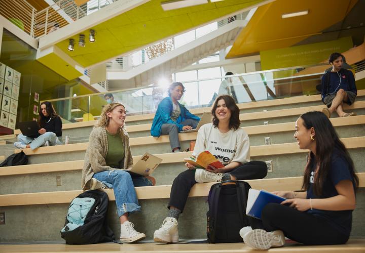Students sitting and talking in Karl Miller Center