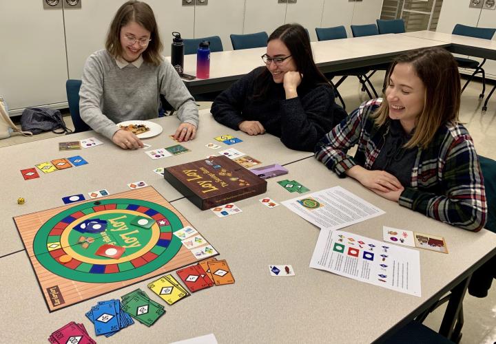 students playing board game