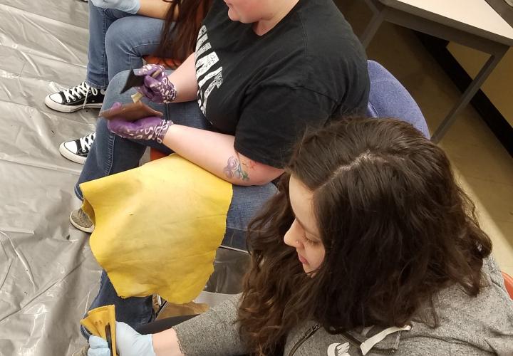 students working with stone tools