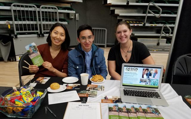 Three students at tabling event