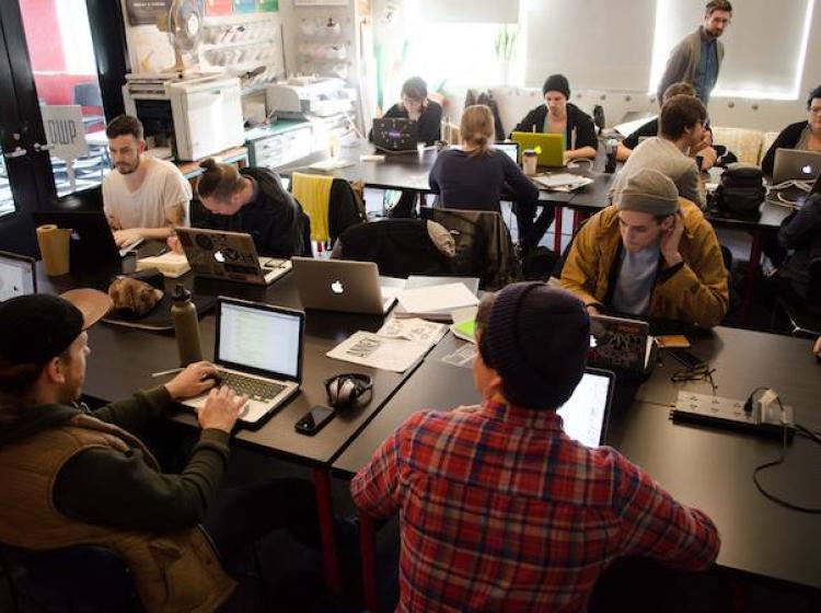 Students working at laptops during an A+D Projects class in progress