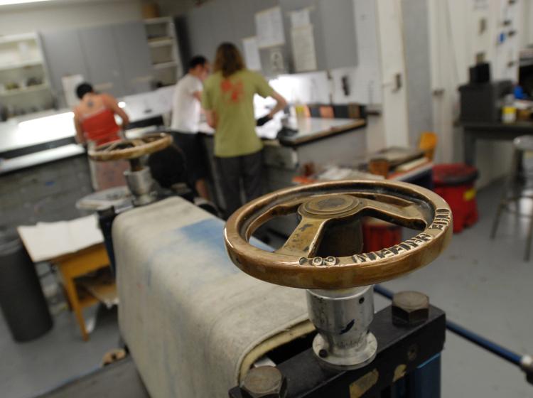 Griffin etching press; students at work in background
