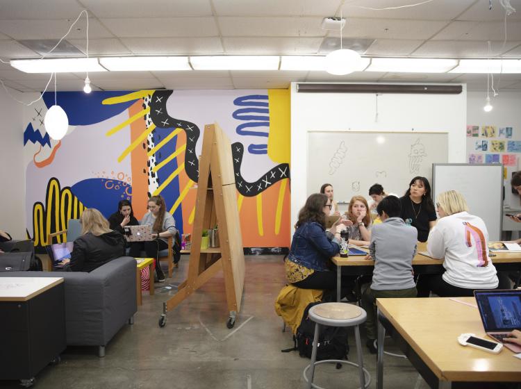 Student lounge and workspace with sofas and tables for working outside of class