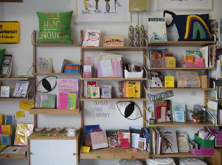 Shelving with design books and zine collection