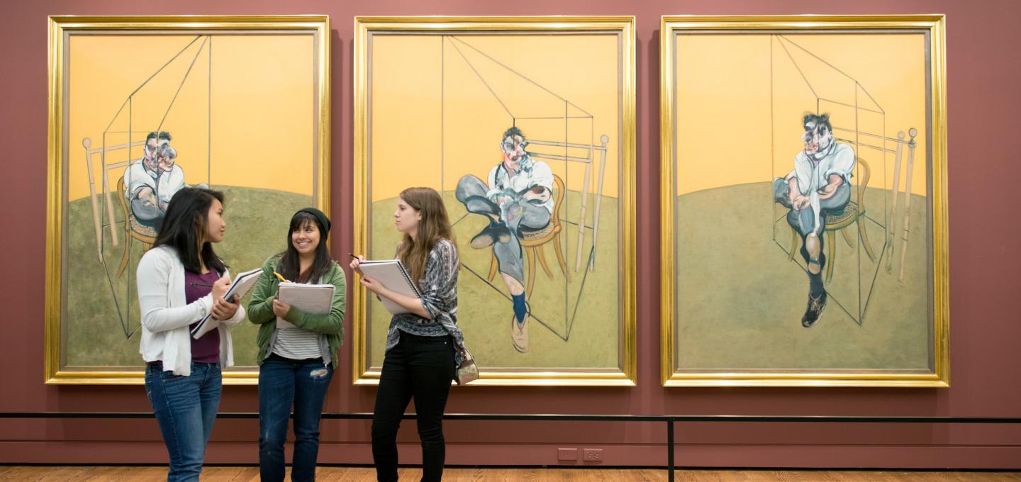 Art history students gathered in front of Francis Bacon paintings at the Portland Art Museum