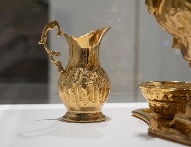 Detail of golden tea service.