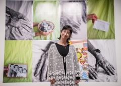 Olivia DelGandio standing in front of her instllation at the Schnitzer Prize exhibition.