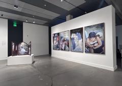 Installation view showing 4 large format photographs and one photographic work framed as a winged altarpiece.