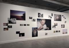 Grouping of photos by Savannah Noel scattered across a gallery wall in large and small format.