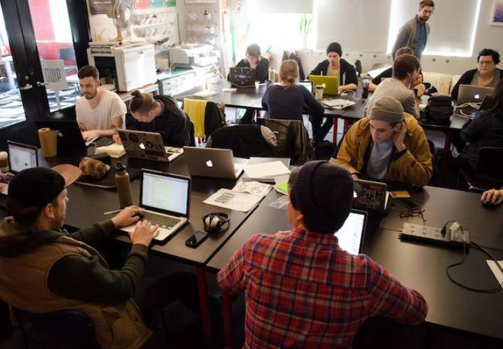 Students working at laptops during an A+D Projects class in progress