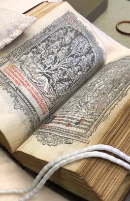 A manuscript, open to a page with a woodcut illustration, in the PSU library's special collections