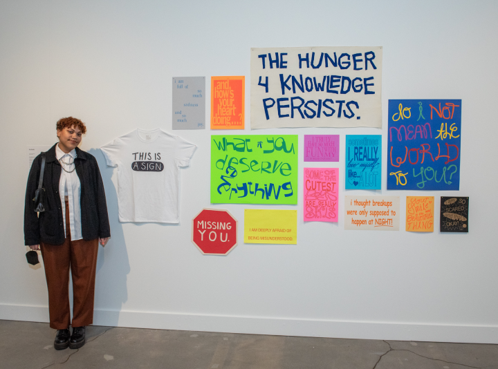 Nia Musiba standing next to her art installation "This is a sign"