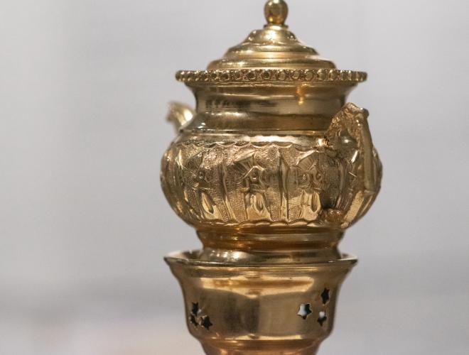 Detail view of golden tea service.