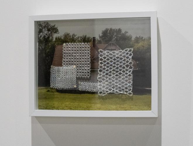 Photograph of a house with squares of woven beads overlaid.
