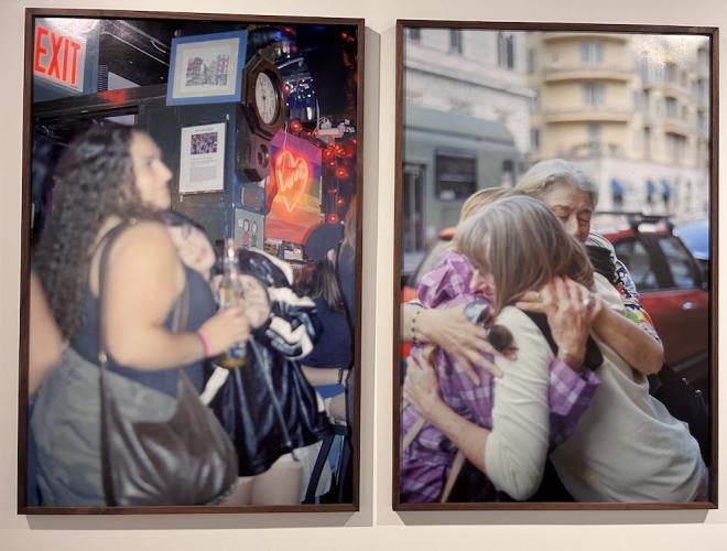 Two large format photographic prints on a gallery wall.