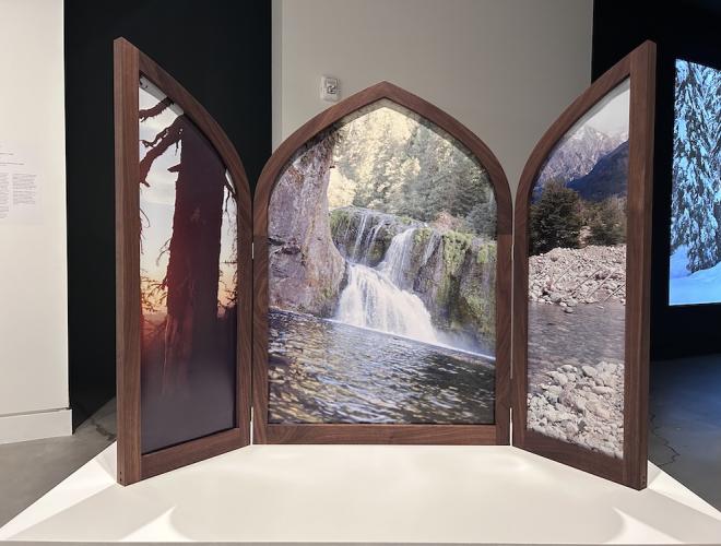 Landscape photographs framed in a winged altarpiece.