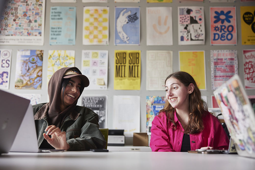 Graphic design students working in studio