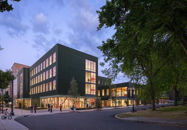 PSU's new art building, shown from the exterior, framed by trees