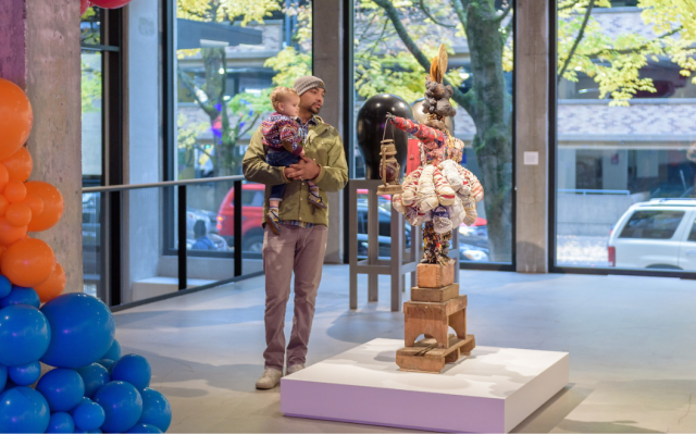 Image of Student with child at the Art museum on campus