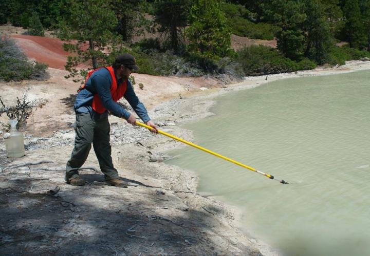 Student at acidic hot spring in Lassen Volcanic National Park