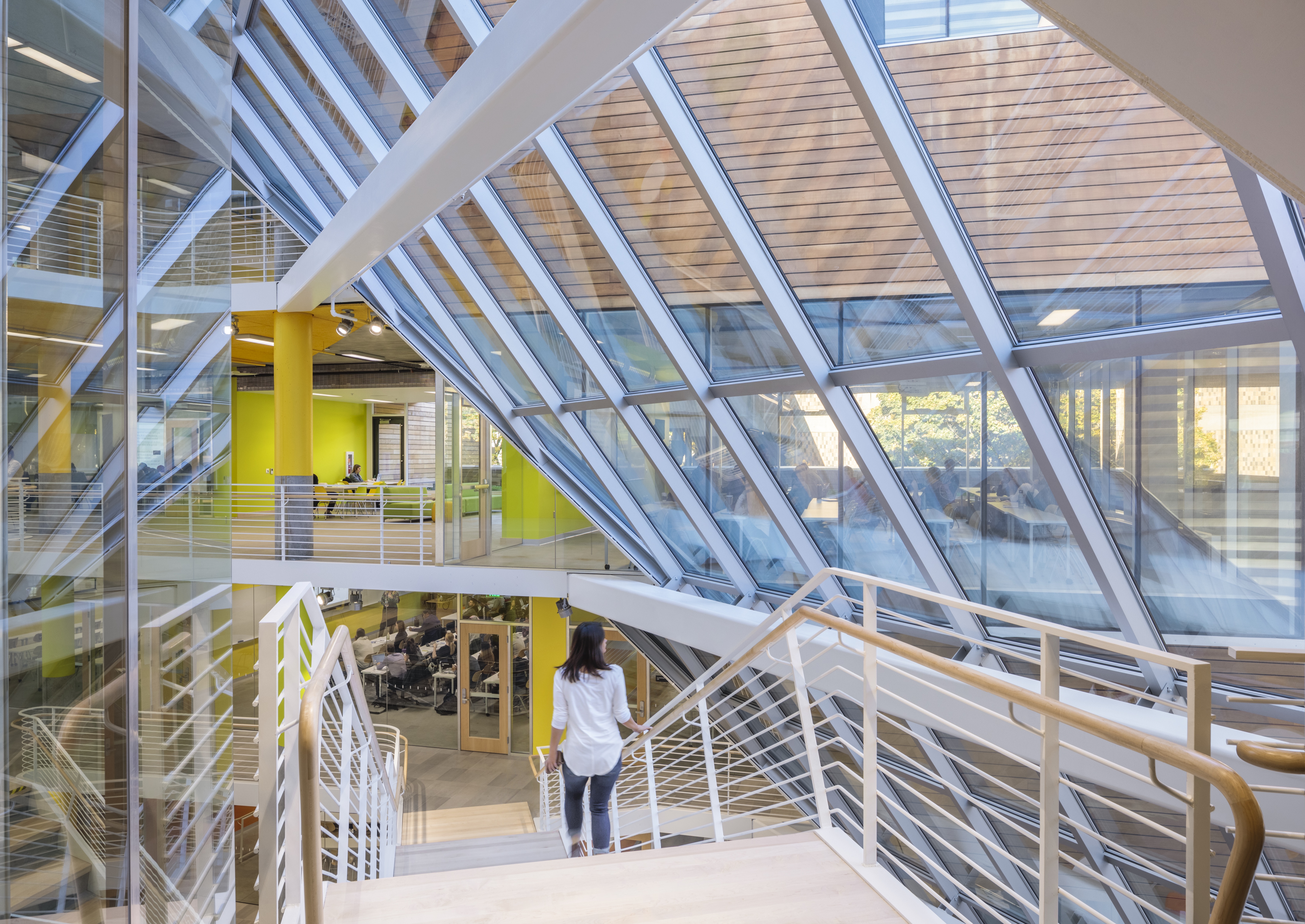 Person walking down stairs in Karl Miller Center