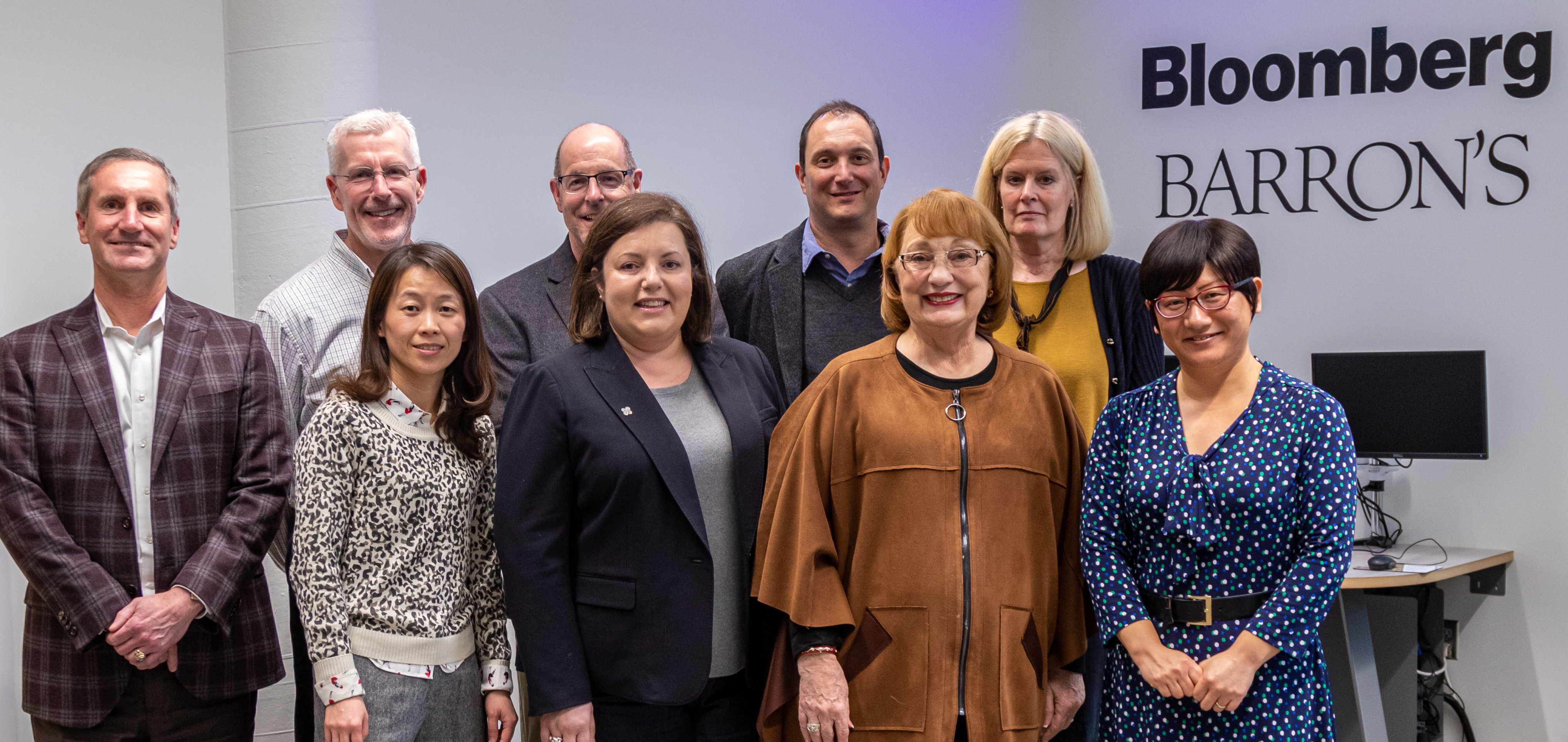 A group of faculty posing with Judith McGee