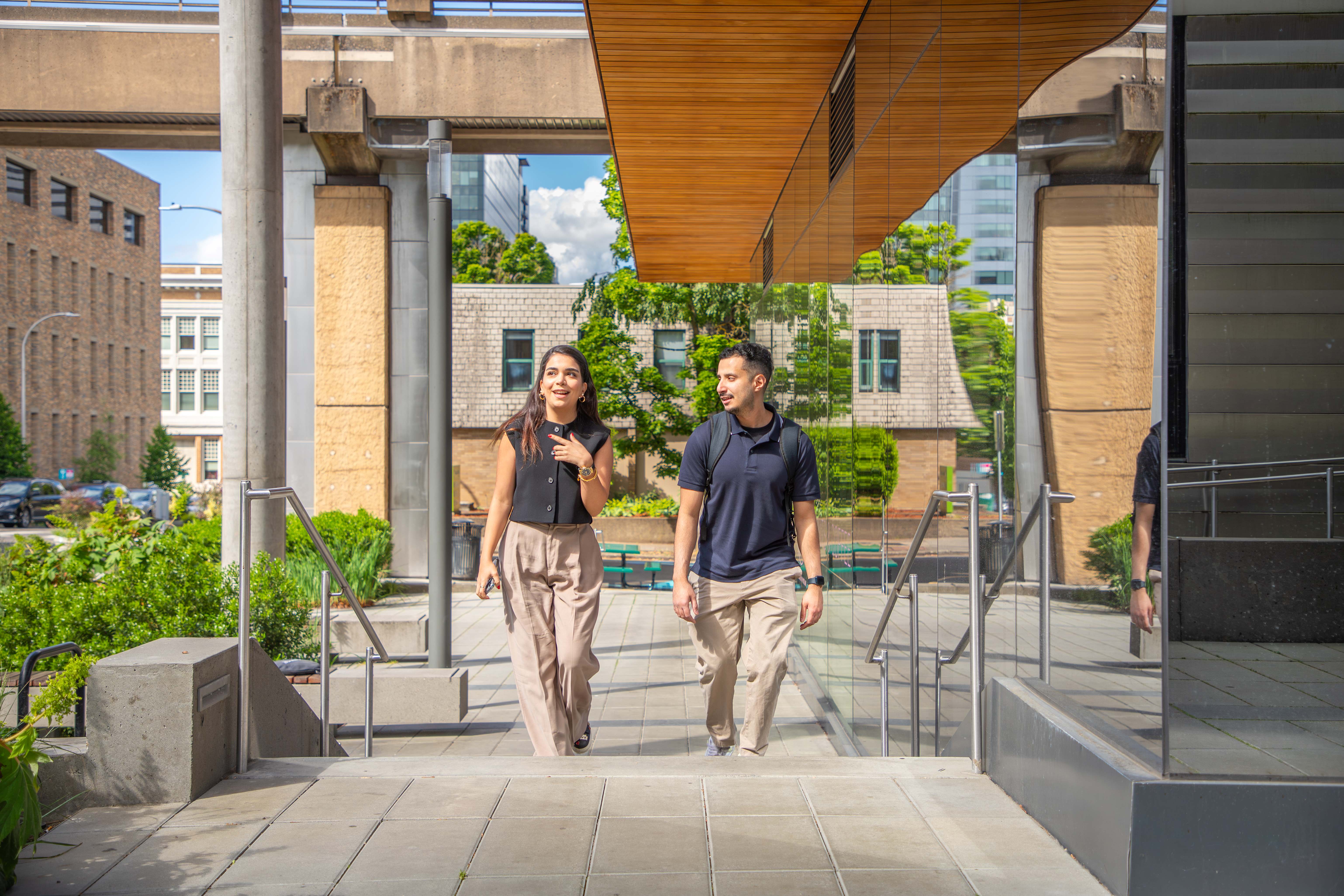 Two Grad Students walk by KMC