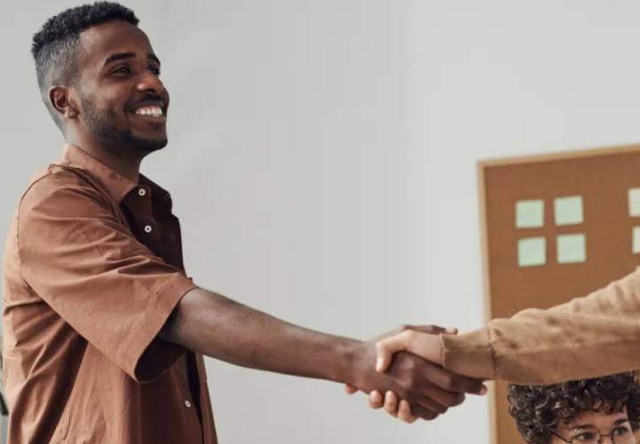 Person shaking hands.