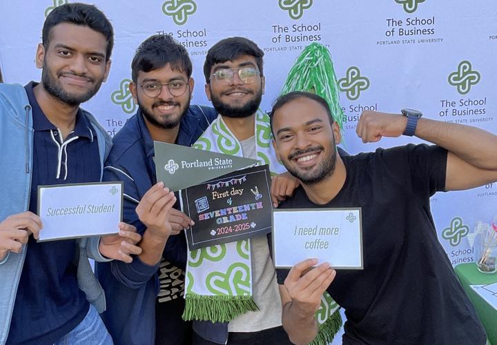 Students posing at The School of Business Photo Booth