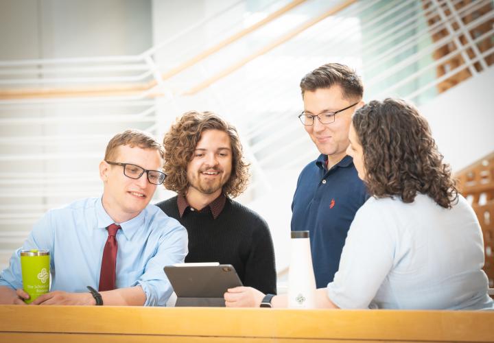 scholarship photo of four grads