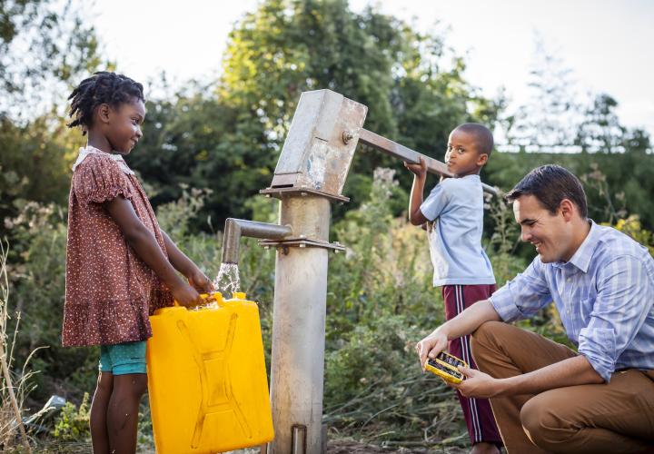 Researcher with water pump