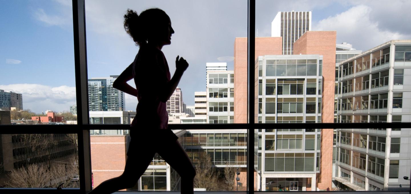 Person running on the rec center track