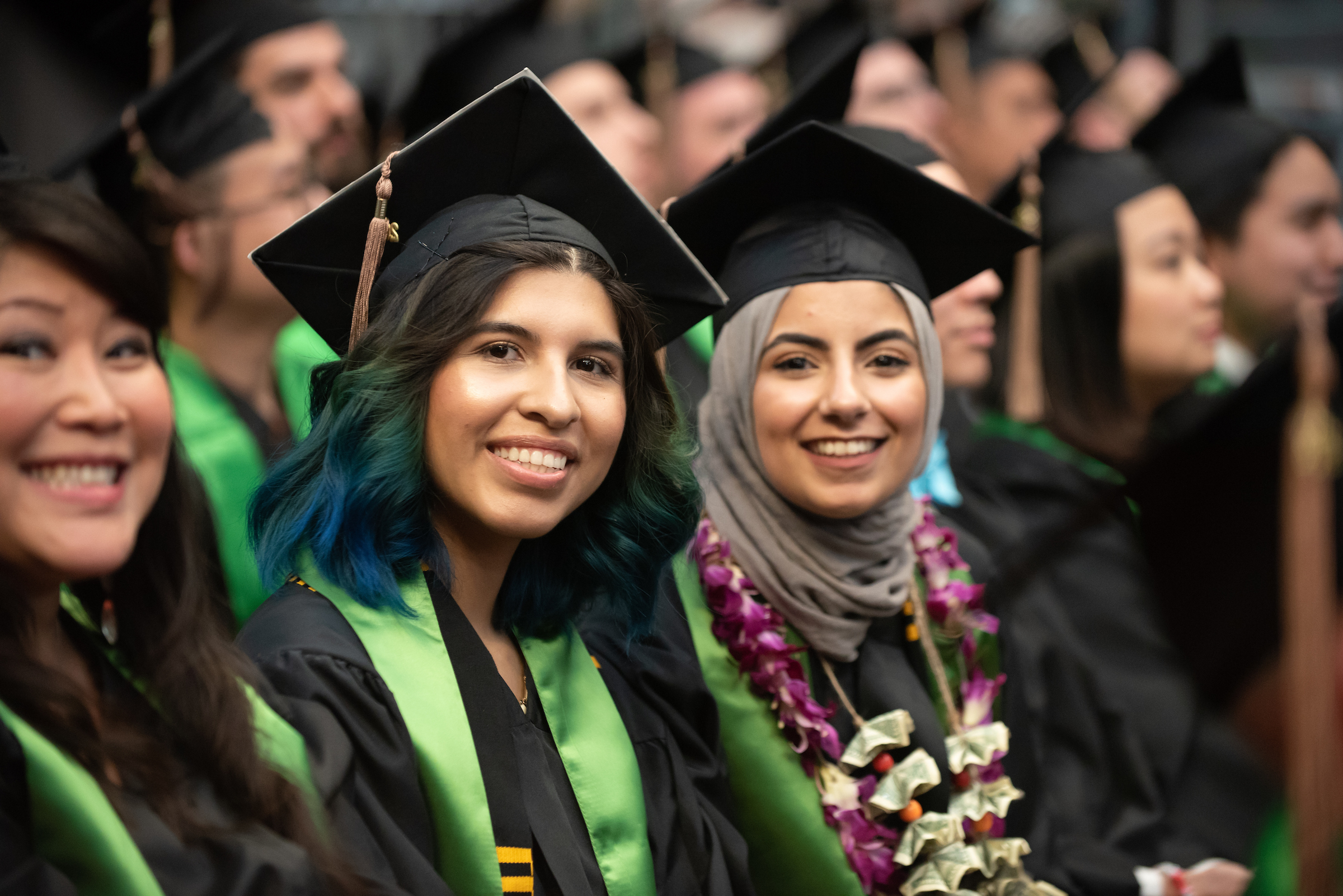 students posing for graduation