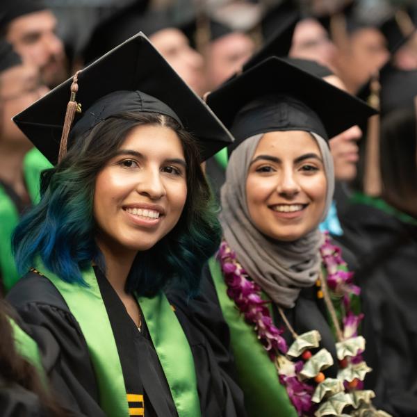 students posing for graduation