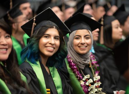 students posing for graduation