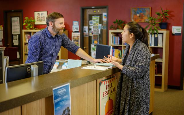 Student signing in at University Career Center front desk