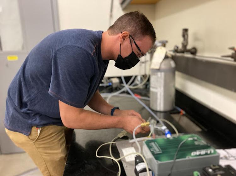 CCAR REU student working in lab