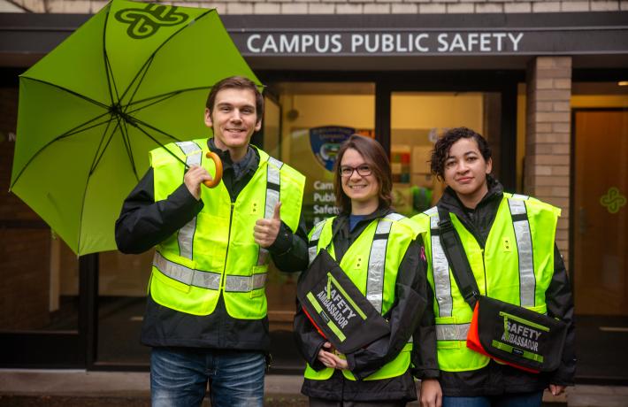 Campus Safety personnel in front of the Campus Public Safety office.