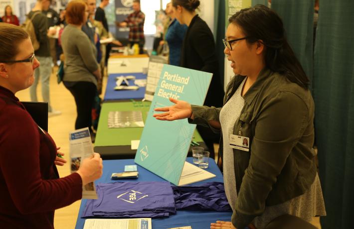 A student presenting their work at an event.