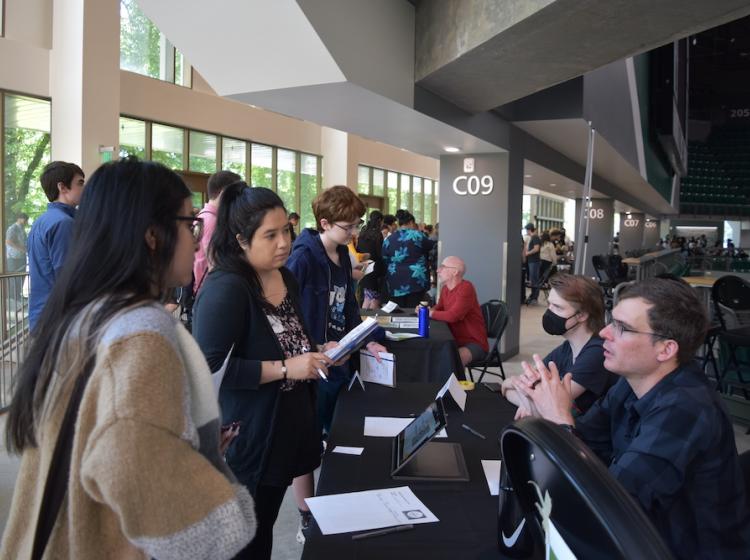 Students at the 2023 Summer Research Academy tabling fair