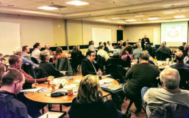 group of people sitting at a conference