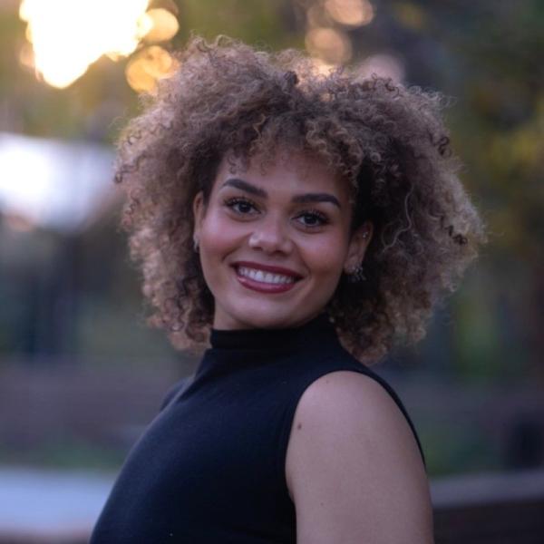 Photo of Nya MBock, Emcee for An Evening with CWL