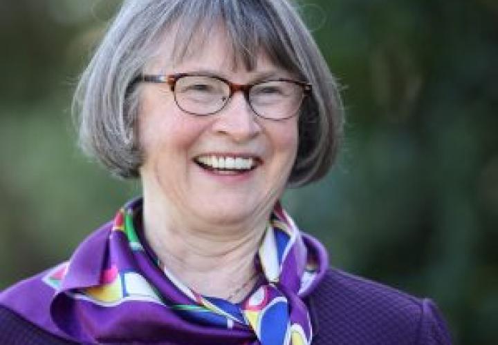 Headshot of Senator Ginny Burdick smiling in a purple sweater