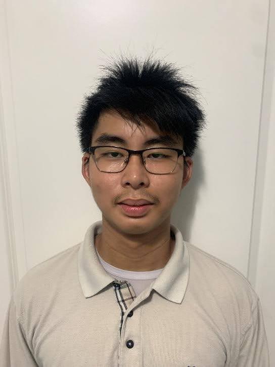 Photo of Marcus Lam, he is a tan man with black hair and glasses. He is wearing a white collared shirt in front of a white background.