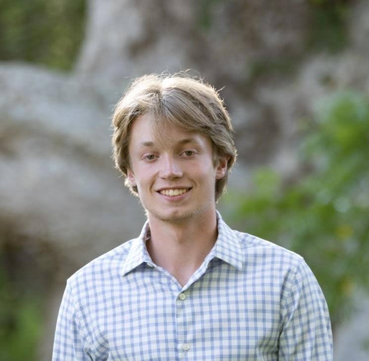 Sean Murphy, a white man with blonde hair, smiling at the camera.