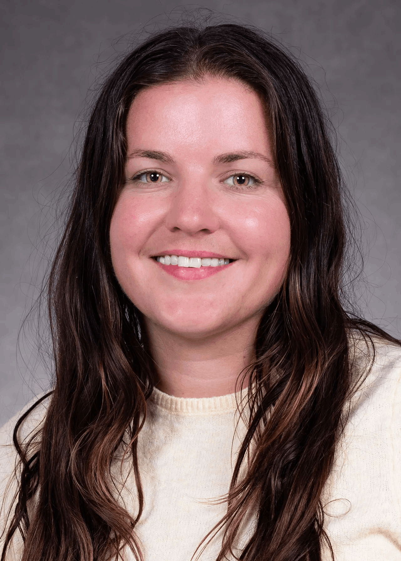 A professional headshot of Morgan Balabanoff, a white woman with long dark hair and light brown eyes. 
