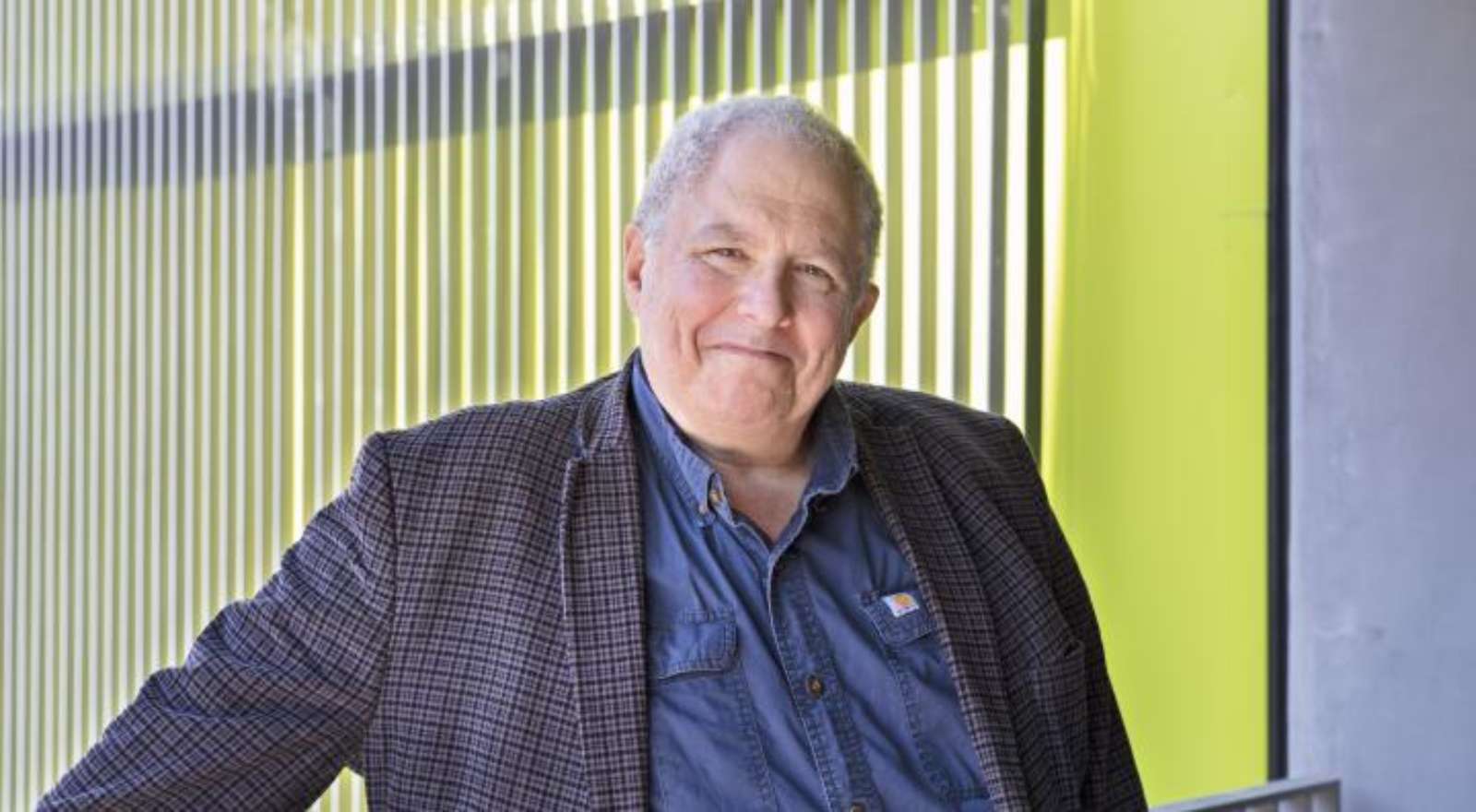 A professional portrait of Dr. Rob Strongin, an elder white gentleman with short white hair and wearing a suit jacket.