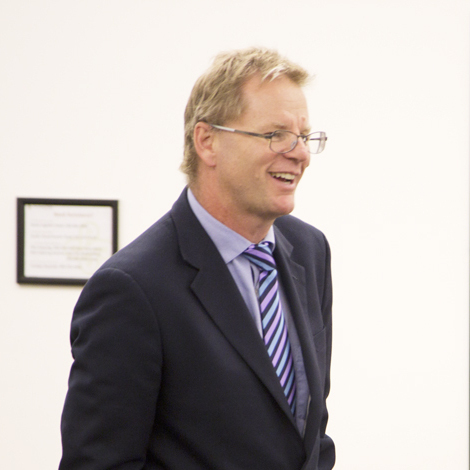 Professional headshot of Kevin Reynolds